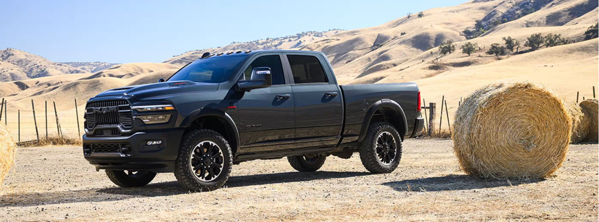 Ram Pickup Truck parked next to hay