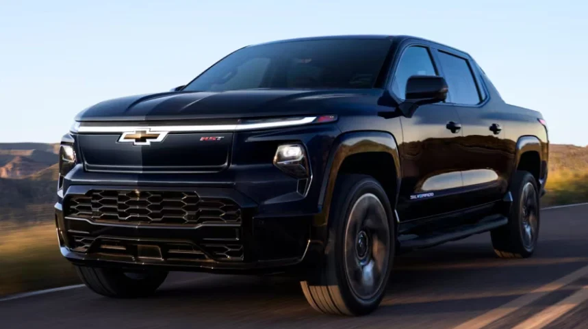 Black Chevrolet Truck driving on the road