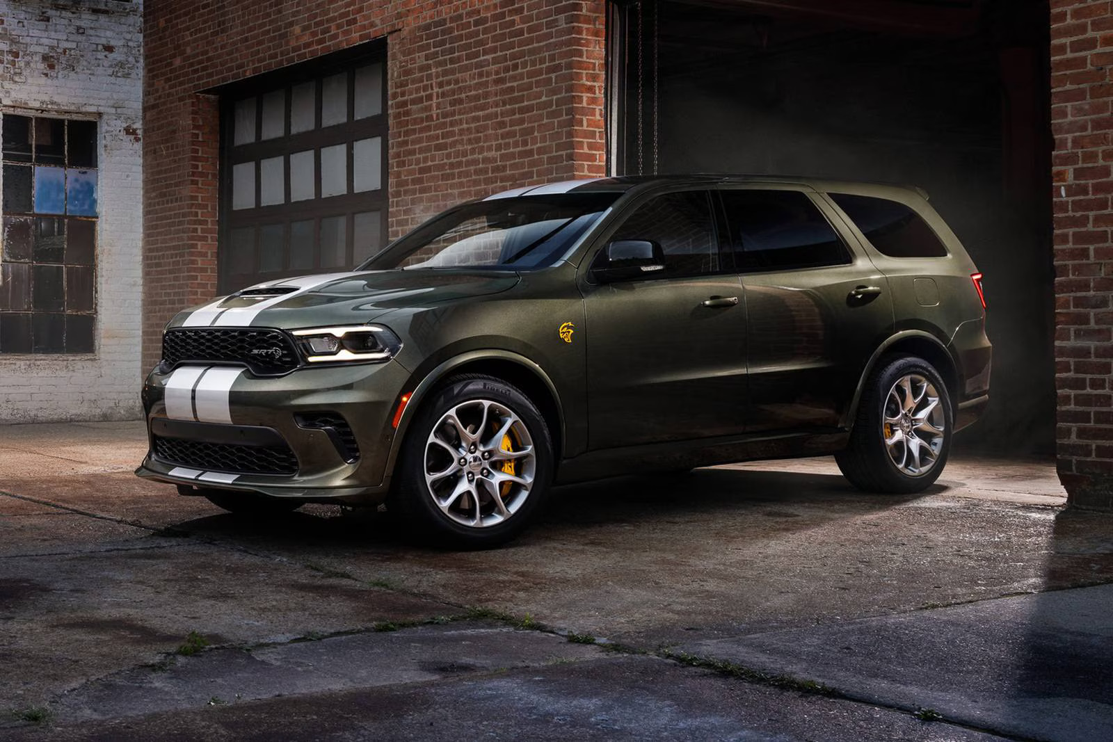 A dodge durango sitting parked in front of a building.