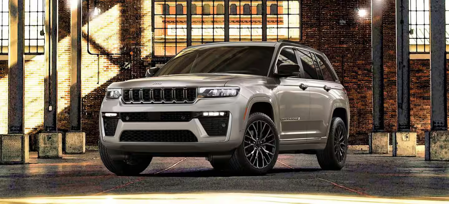 A jeep grand cherokee sitting parked inside.
