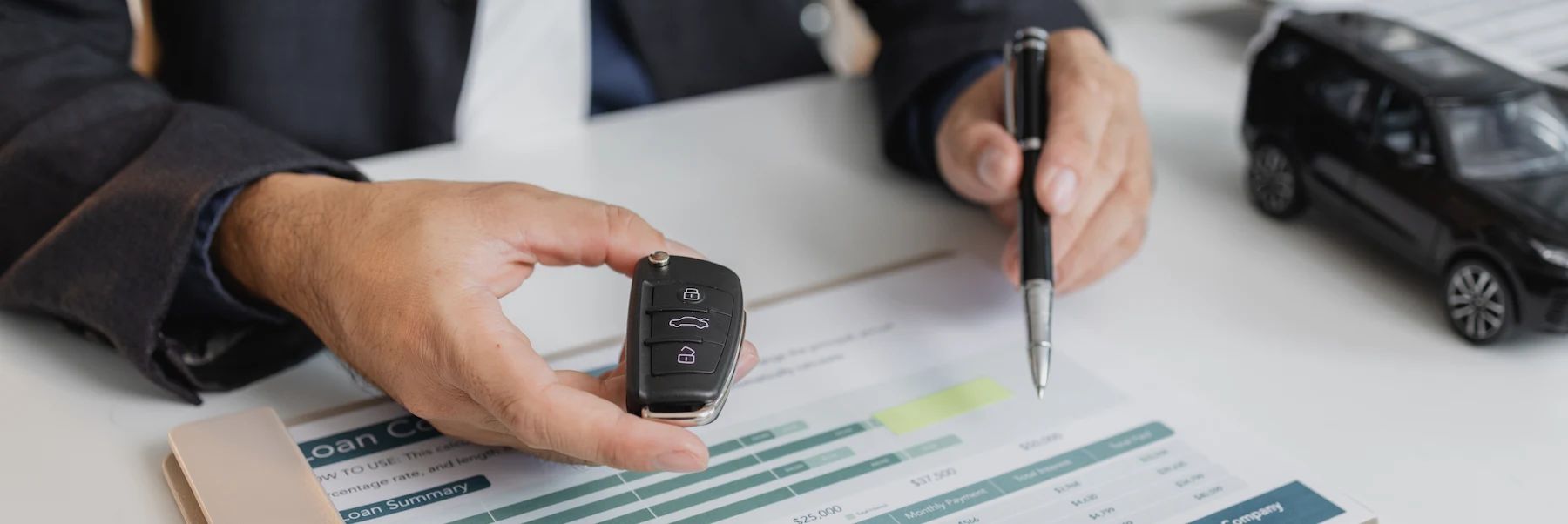 Car Loan Agreement with Keys and Black Car